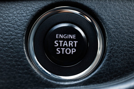 Engine start stop button of a car, macro close up short.