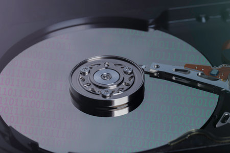 Backup data, database recovery, security data, and device repair service, Inside of internal Hard Drive HDD. dismantle from the computer. number binary digital on disc.の写真素材