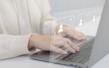 Businesswoman working on laptop computer with electronics document icon on virtual screen, e-document online, efficiently manage files, Document Management System (DMS) and paperless office concept.の写真素材