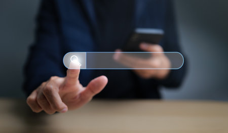 Data Search Technology SEO Search Engine Optimization. Search button on virtual screen touching with finger of man for data and information. website search concept.の写真素材