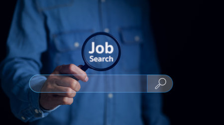 Job search concept. Man using magnifying glass Search on virtual screen for information. find a job, unemployment, recruitment, job interview, data Search Technology Search Engine Optimization.の写真素材