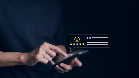 Customer review satisfaction feedback survey concept. User give rating to service excellent experience on mobile phone application, Client evaluate quality of service reputation ranking of business.の写真素材