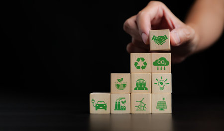 Cooperation to reduce CO2 or carbon dioxide emissions to limit global warming and climate change, offset by planting tree. Net zero greenhouse gas emissions target. Climate neutral long term strategy.の写真素材