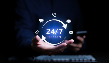 A man holding icon virtual 24/7 support services for worldwide nonstop and full-time available contact of service concept. Assistance customer services, Care and consulting client 24hr, Call Center,の写真素材