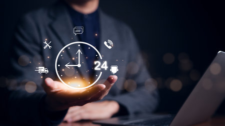 Businessman holding clock and icon contact 24 hr support services on for nonstop and full-time...