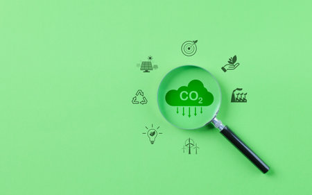 Magnifying glass with reduce CO2 emission concept, Environment icons decrease CO2, Reduction carbon footprint, Renewable clean, Sustainable energy, Carbon neutral, Globe climate Change risk, Net Zero,の写真素材