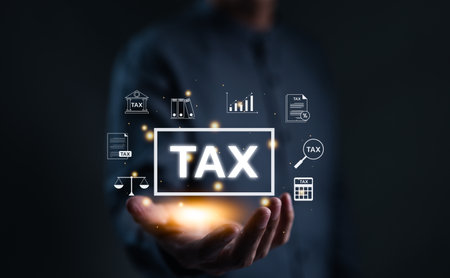 TAX concept. Man show TAX for individual income tax return form online for tax payment. government, state taxes. Data analysis, financial research, report. Calculation return. Value added Tax VAT,の写真素材