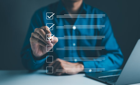 Businessman using pen to tick correct sign mark in checkbox for quality document control checklist...