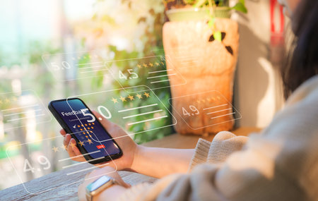 Customer review satisfaction feedback survey concept. Online customer feedback and rating on smartphone. Scores and star ratings in user review app. Service experience, Evaluation of product quality,の写真素材