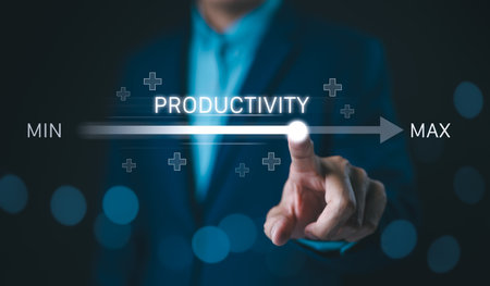 Increasing Productivity and Efficiency Concept. Businessman adjusting virtual slider from min to max, process to increase productivity and efficient. Progress and optimization in business operations.の写真素材