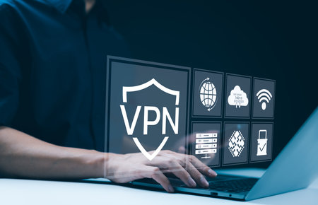 VPN Virtual Private network protocol concept, A person using laptop with interface displaying VPN technology and cybersecurity icons, representing secure internet access and data protection. App VPN,の写真素材
