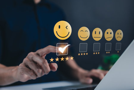 Customer review satisfaction feedback survey concept. A user selects five star rating on a virtual interface, showcasing customer satisfaction, feedback, and survey evaluation in internet networking.の写真素材