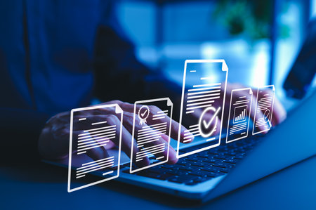 Document Review and Quality Control Process Concept. Person using laptop with document and checkmark icons representing review, validation, approval, verification, auditing, compliance, and workflow.の写真素材
