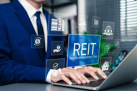 REIT, Real Estate Investment Trust Financial Concept. Businessman using laptop with REIT investment icons. property, finance charts, growth, mutual fund, investor, return, and income strategy.の写真素材