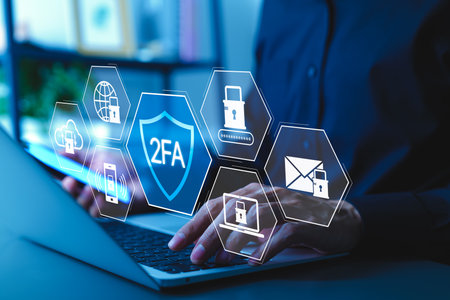 Two-Factor Authentication 2FA Cybersecurity Concept. Man using laptop with icons 2FA, lock, and data protection elements representing secure user authentication systems. encryption, password, login,の写真素材