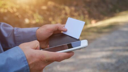 Woman shopping on the internet with smartphone and credit cardの写真素材