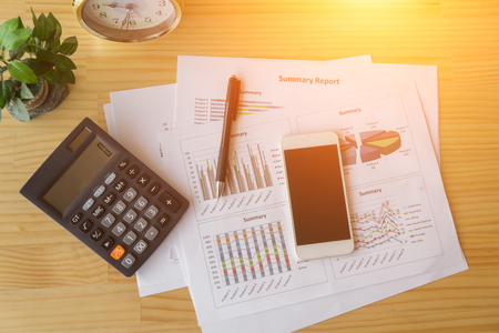 business documents with charts growth, phone and pen. workplace businessman.の写真素材
