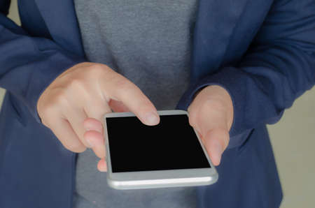 Use a cell phone with copyspace at work.の写真素材