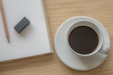 Open Notebook With Blank Pages, Pen And Cup Of Coffee On Wooden Table. Top Viewの写真素材