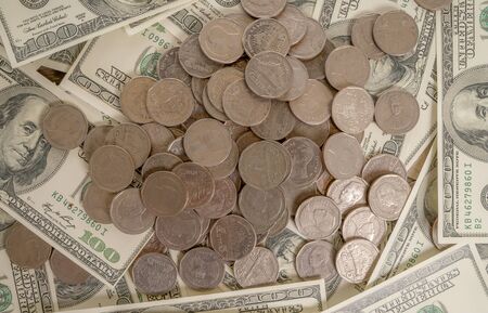Coins on the background of bank dollars, investment and business ideas.の写真素材