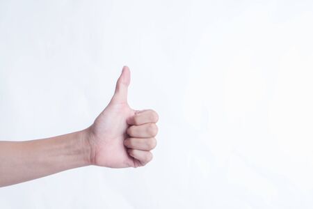 man hand with thumb up isolated on white backgroundの写真素材