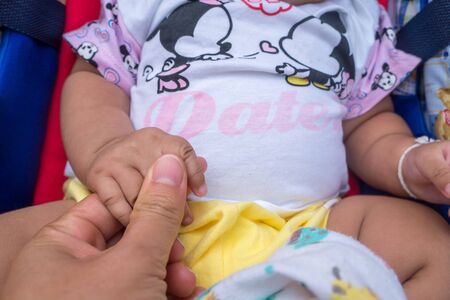 Parents and children in Asia join hands.の写真素材