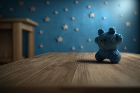 Watercolor doll sitting on a brown empty table on a blue starry wall in a childs bedroom.の写真素材