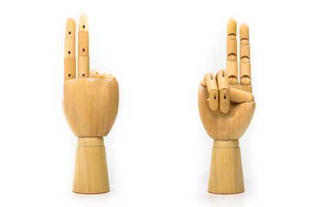 Wooden finger symbol placed on white backgroundの写真素材