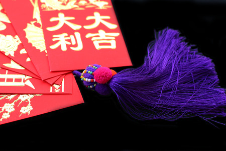 Chinese red pockets on black backgroundの写真素材