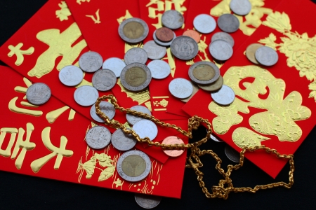 Chinese red pockets ,gold and silver nuggetsの写真素材