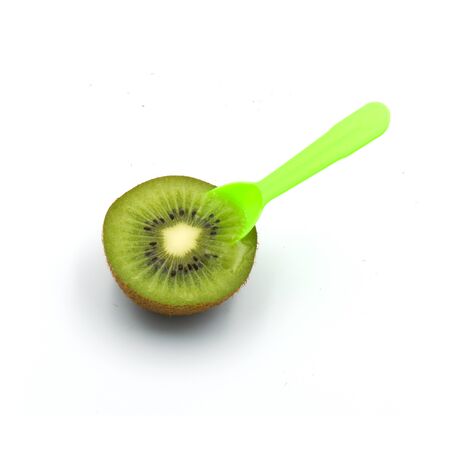 fruit half kiwi And plastic spoon isolated on the white background. の写真素材