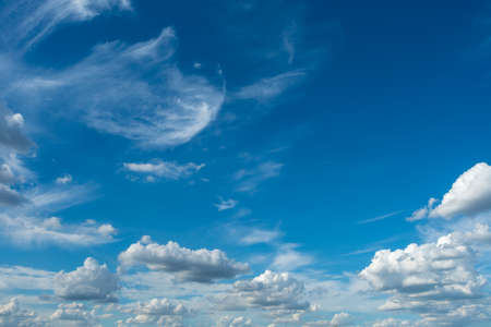 Blue sky with white clouds, (Cirrocumulus clouds)  in blue sky on sunny peaceful day.