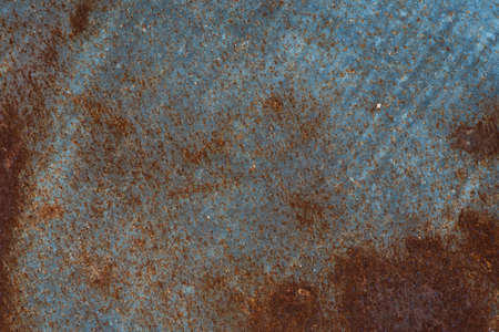 Steel blue plate There are orange rusty stained metal wall texture pattern .