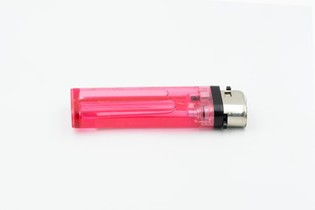 Close-up red gas lighter isolated on the white background.の写真素材