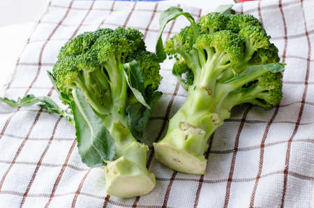 Two Broccoli on white cloth 