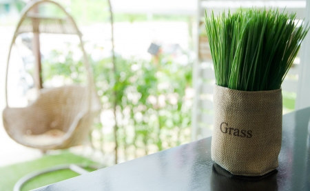 Fake grass in a brown bag at restaurant の写真素材