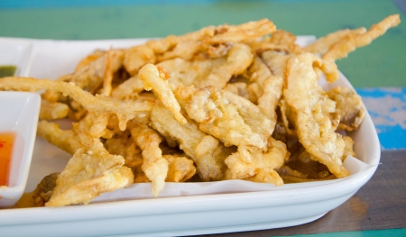 Delicious fried mushrooms with spicy and sweet sauce 