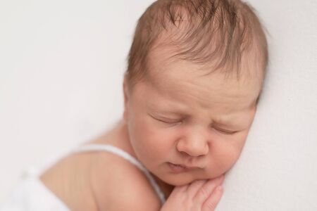 Sleeping newborn baby. Healthy and medical concept. Healthy child, concept of hospital and happy motherhood. Infant baby. Happy pregnancy and childbirth. Children's theme. Baby and childen's goods.の写真素材