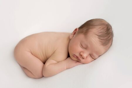 Sleeping newborn baby. Healthy and medical concept. Healthy child, concept of hospital and happy motherhood. Infant baby. Happy pregnancy and childbirth. Children's theme. Baby and childen's goods.の写真素材