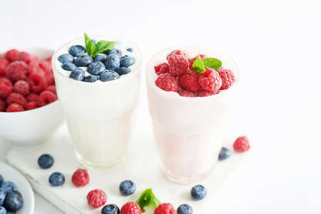 Yogurt cocktail and parfait. Natural detox. Liquid ice cream. Healthy food and breakfast. Good morning. Berry Milk Smoothie with blueberries, strawberries, raspberries. Fresh diet dessert. Summer cardの写真素材