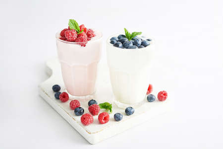 Yogurt cocktail and parfait. Natural detox. Liquid ice cream. Healthy food and breakfast. Good morning. Berry Milk Smoothie with blueberries, strawberries, raspberries. Fresh diet dessert. Summer cardの写真素材
