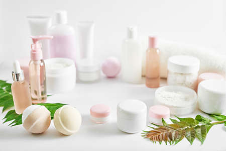 Mockup composition Natural cosmetics ingredients for skincare, body and hair care.Top view bottles with facial treatment product white background. Makeup Layout. Set of traditional spa productsの写真素材