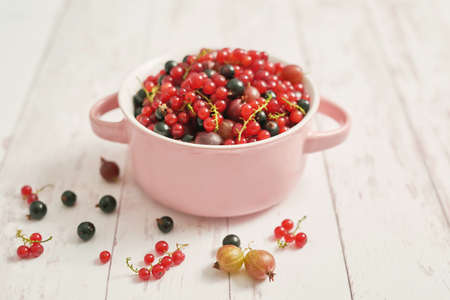 Colorful fresh berries on white background. Top view. Summer Organic Berry Cherry, Currant,...