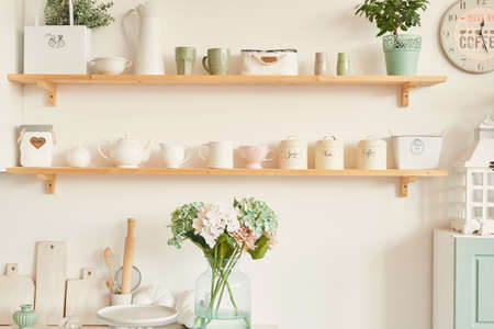 bright kitchen in the style of Provence, on the table dishes and a bouquet of flowers in a vaseの写真素材