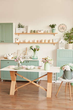 bright kitchen in the style of Provence, on the table dishes and a bouquet of flowers in a vaseの写真素材