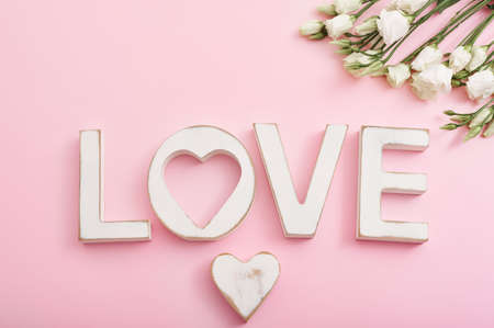 Valentines Day romantic background with heart and flowers. Valentine Card with copy space. Love letters on pink background. Valentine's day greeting card template February 14.の写真素材