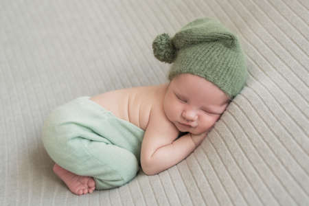 Sleeping newborn baby. Healthy and medical concept. Healthy child, concept of hospital and happy motherhood. Infant baby. Happy pregnancy and childbirth.の写真素材