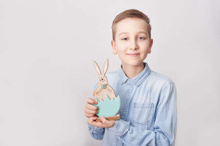 Child boy with easter bunny. Happy Easter holiday background concept. Boy with rabbit. Easter greeting card. Easter bunny rabbitの写真素材