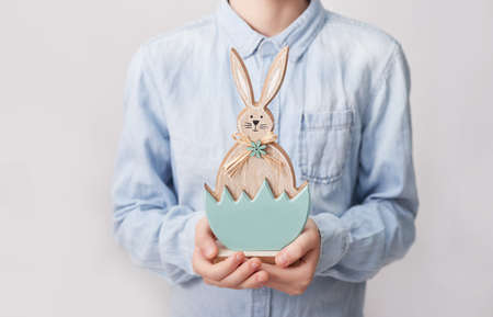 Child boy with easter bunny. Happy Easter holiday background concept. Boy with rabbit. Easter...