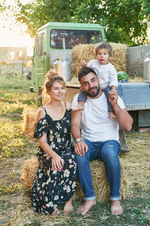 Family on farm.Harvesting Watermelons. Pickup with watermelons. Picnic on farm.Family day.Mother and father's day greeting card.Organic Farming, Food and Vegetable Production.Bio food. Garden produceの写真素材